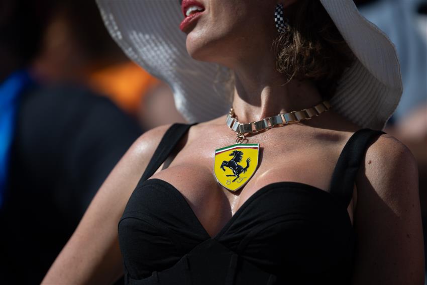 Lady wearing Ferrari badge